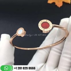 REF . 354734 BVLGARI BVLGARI 18 kt rose gold flip bracelet set with mother-of-pearl and carnelian elements